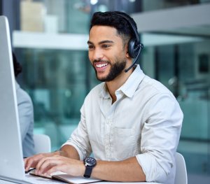 man with headset working at help desk