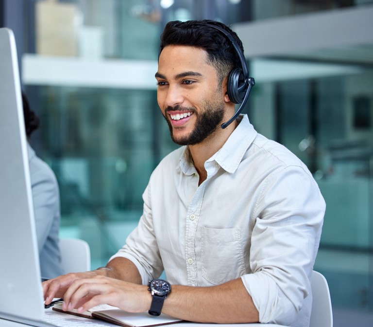 man with headset working at help desk